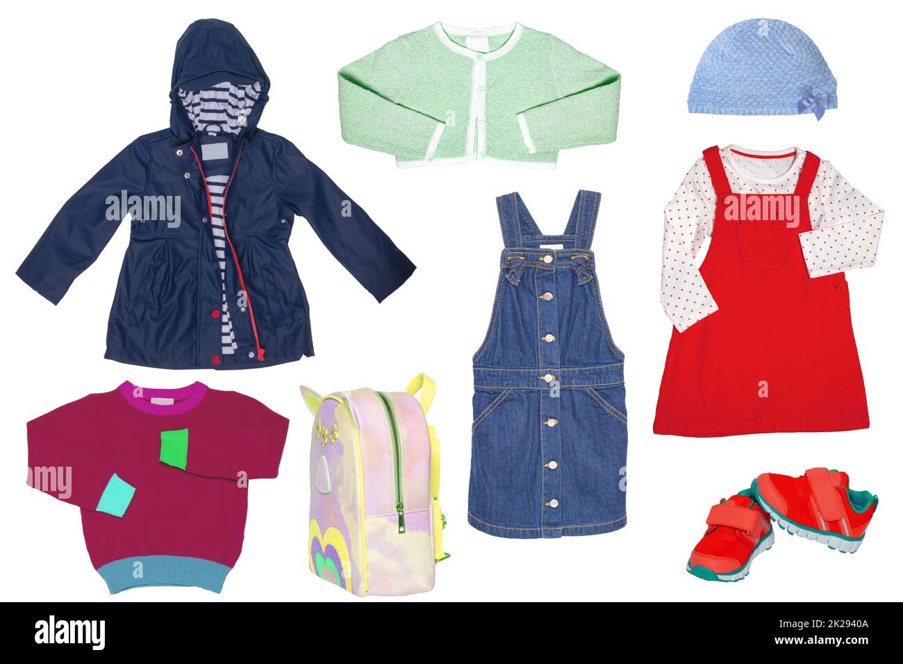 Collage set of little girl spring clothing isolated on a white background. The collection of a stylish blue down jacket, a sweater, a jeans skirt, sneaker,a bag and a dress with hood. Kids autumn and winter fashion. Stock Photo
