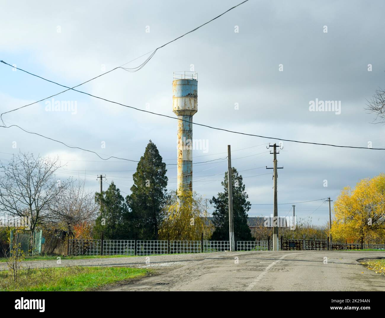 Old water tower in the village. Autumn landscape Stock Photo - Alamy