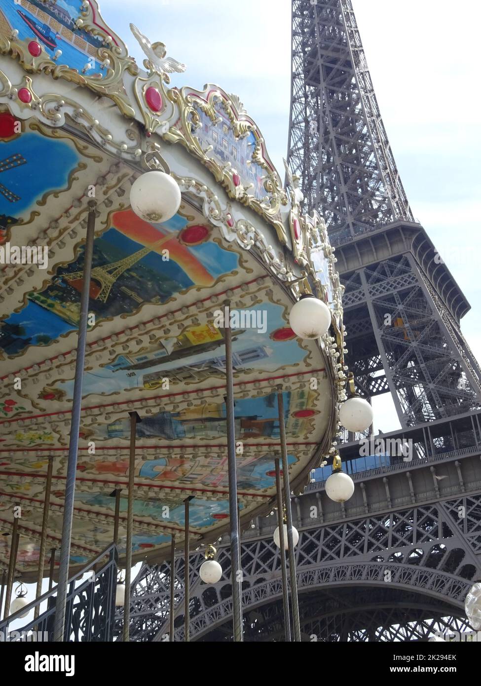 The eiffel tower in paris with the typical parisian carousel worth seeing at every season Stock