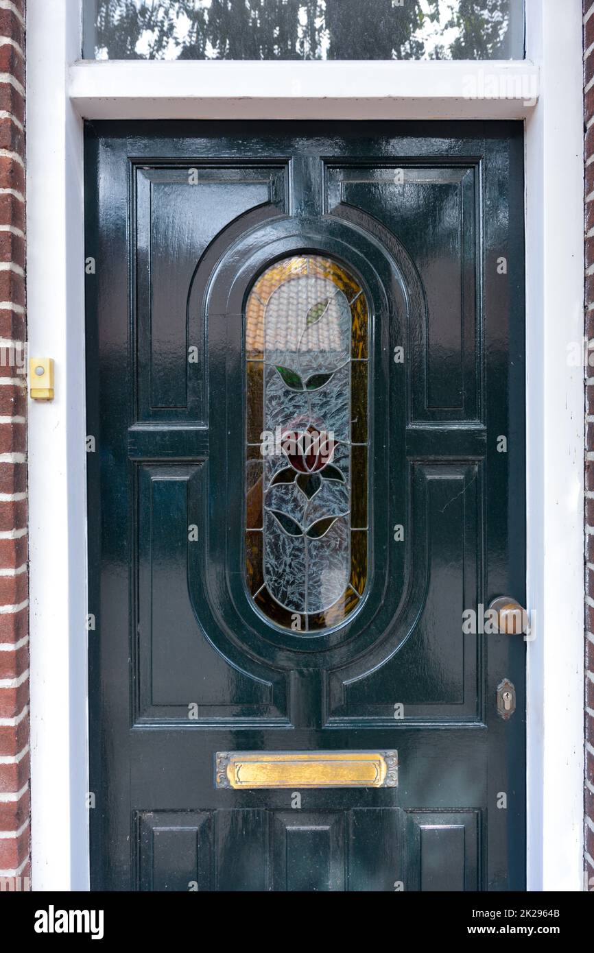 Door with artistic glass insert on a house in the Netherlands Stock Photo