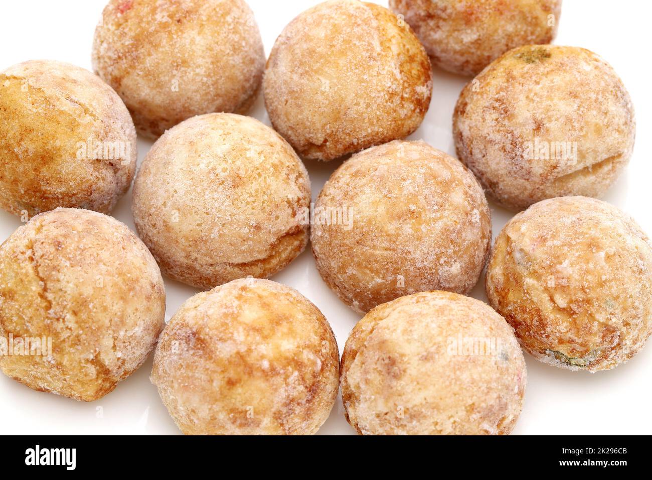 Japanese food, Frozen Takoyaki ball made of flour and octopus on white background Stock Photo