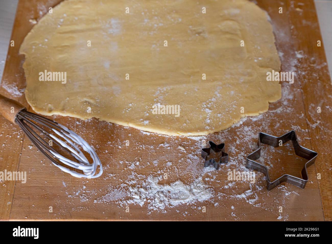 Dough, rolling pin and flour on table, dough kneading with rolling pin