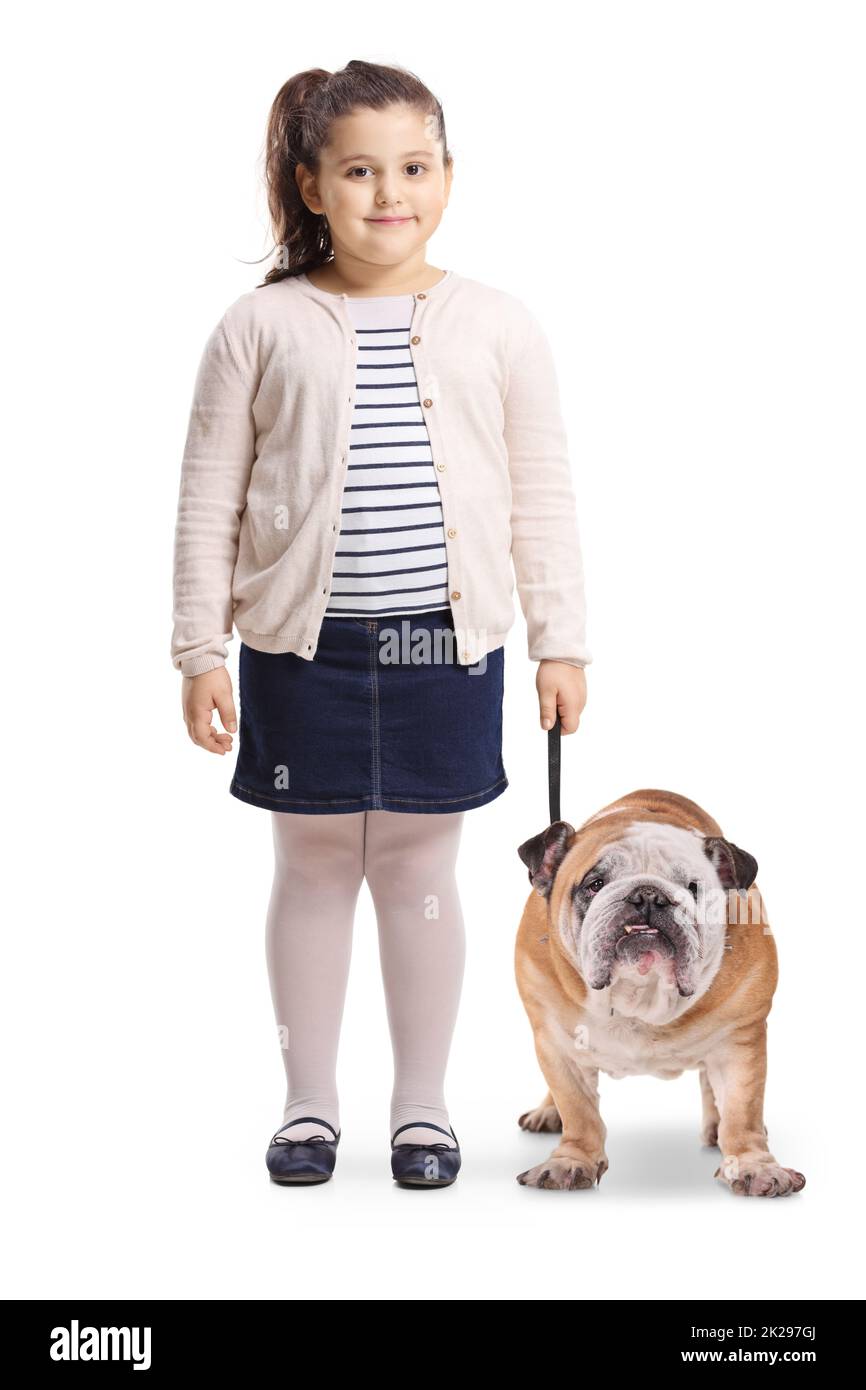 Full length portrait of a little girl with a bulldog smiling at the camera isolated on white background Stock Photo