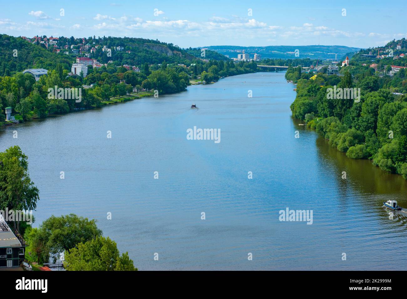 See modern day skyline with Vltava River and beyond. See in Prague in the Czech Republic. You are looking toward the hills and Bohemian countryside. Stock Photo