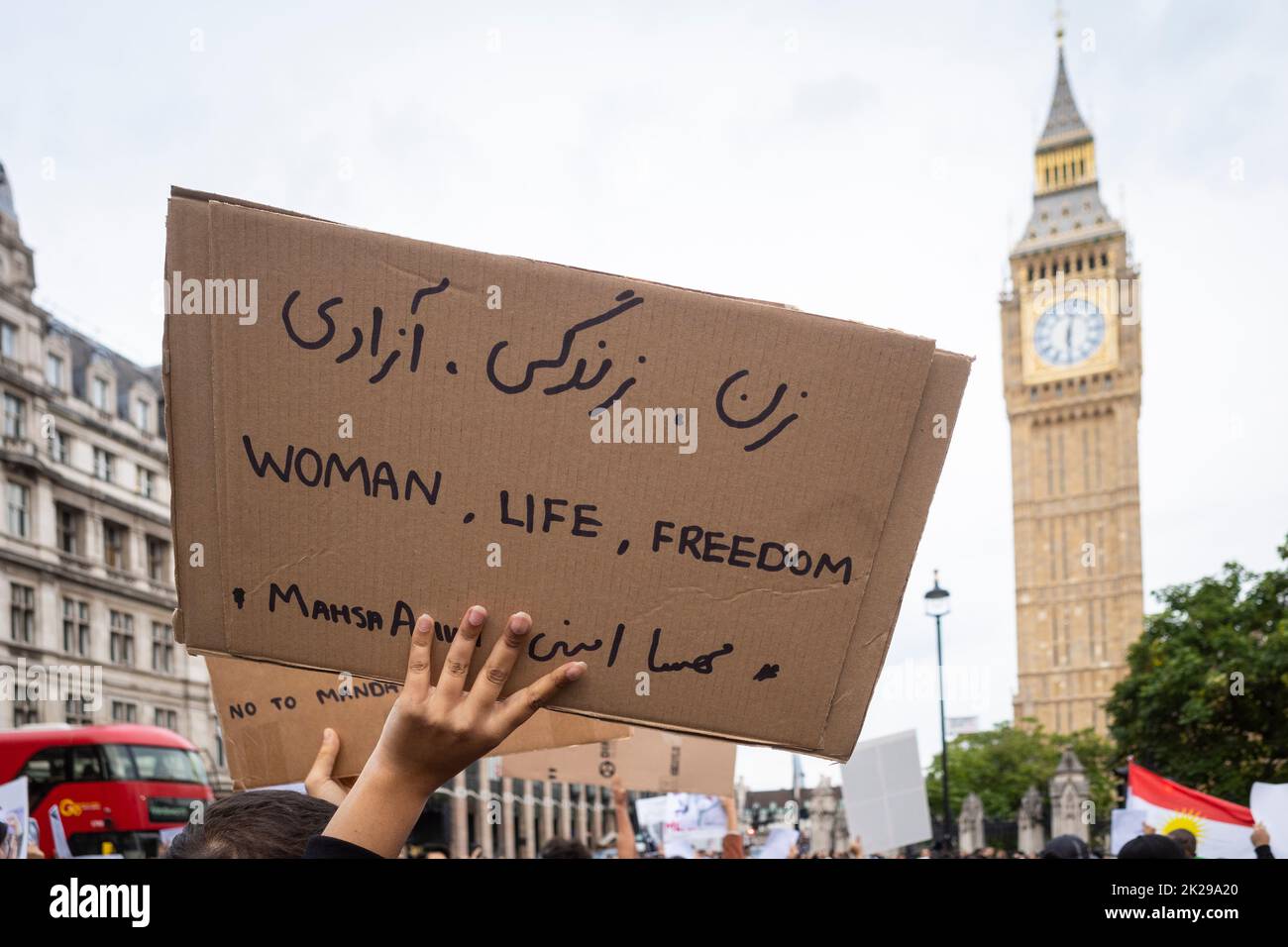 London, UK.  22 September 2022.  A woman with a sign during a protest in Parliament Square by Iranians living in London reacting to news of the death, on 16 September of Mahsa Amini, a 22-year-old Kurdish woman, who died in police custody in Tehran.  Allegedly, she had been detained by Iran’s morality police for wearing a hijab headscarf in an “improper” way.  Protests are taking place in Iran and the access to the internet and social media is now being restricted. Credit: Stephen Chung / Alamy Live News Stock Photo
