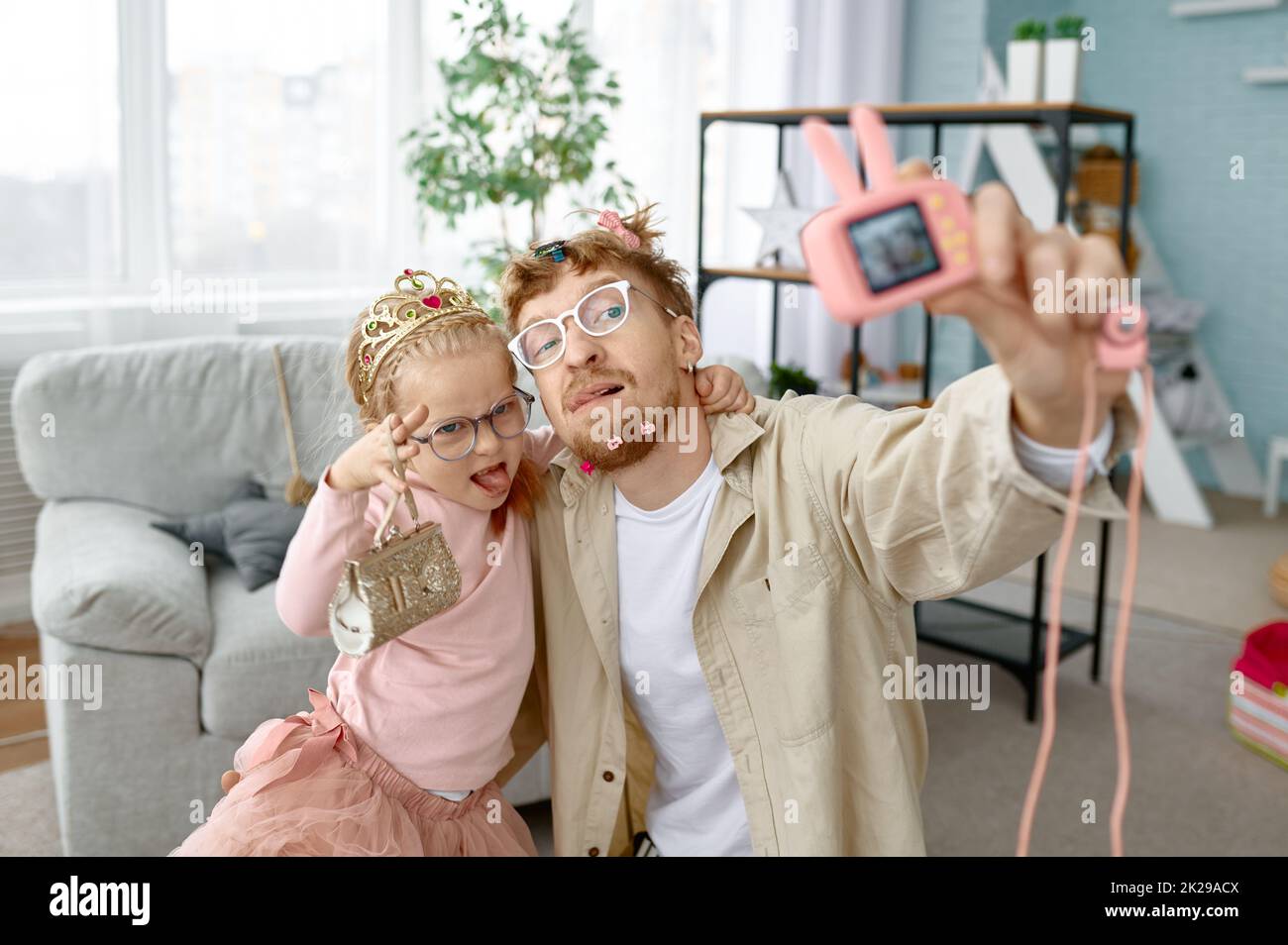Joyful father and daughter making funny selfie Stock Photo