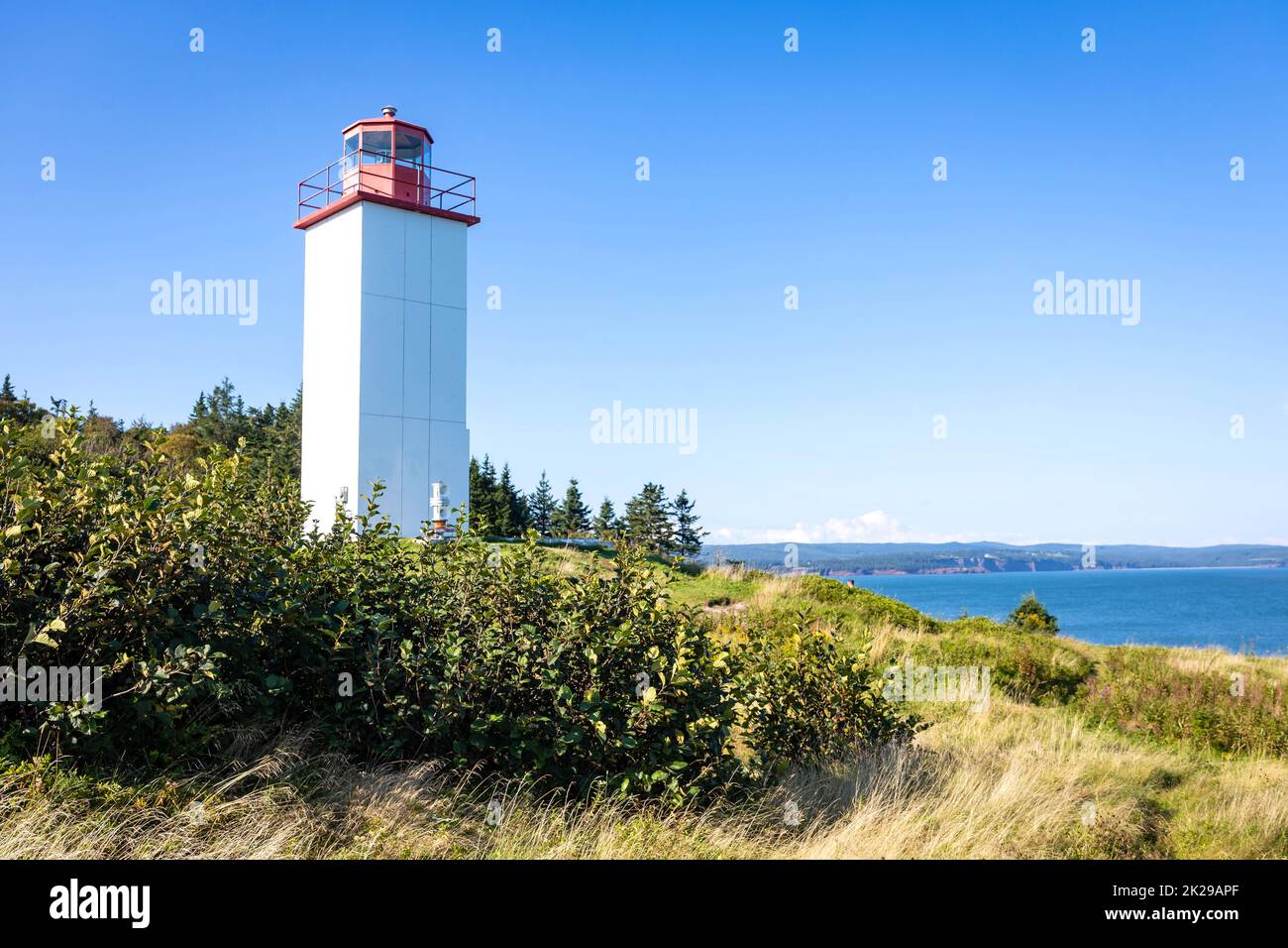 Lighthouse at Quaco Head UNESCO Fundy Biosphere Reserve in Canada scenic place Stock Photo