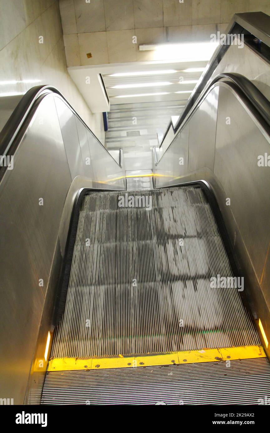 Image of an escalator going from top to bottom. Stock Photo