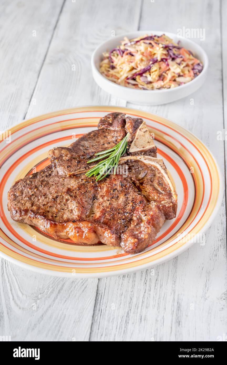 Panfried Tbone steak with fresh rosemary Stock Photo Alamy