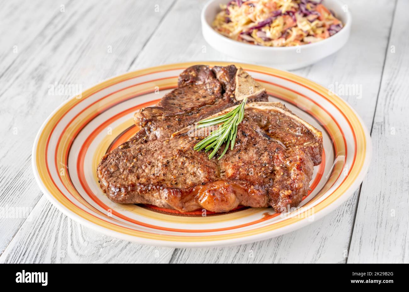 Panfried Tbone steak with fresh rosemary Stock Photo Alamy