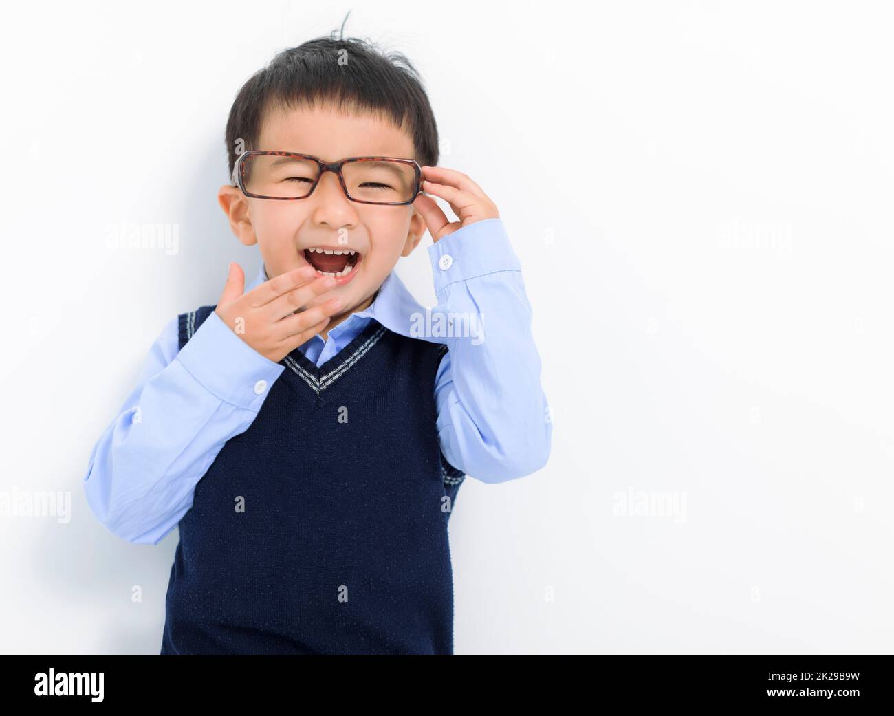 Happy Kid boy holding glasses and having fun Stock Photo Alamy