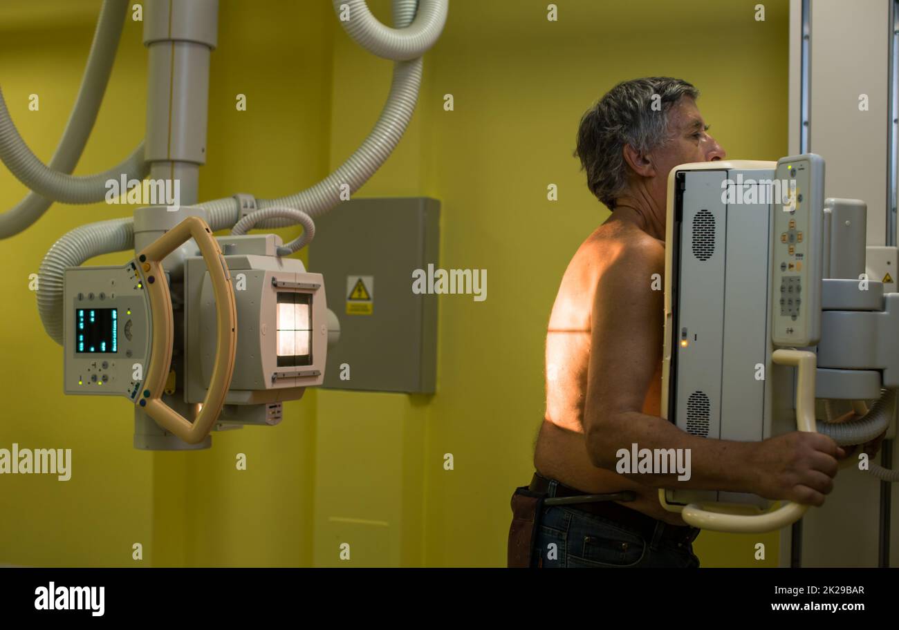 Senior man x-ray medical scan examination in a modern hospital (color toned image) Stock Photo