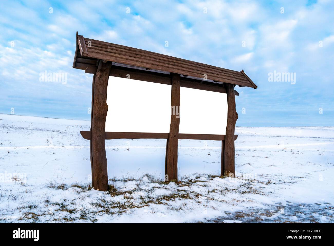 Blank outdoor wooden billboard on a winter landscape Stock Photo