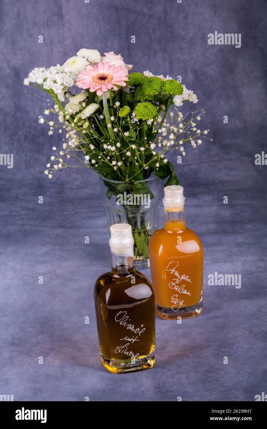 vinegar and oil and flowers - stillife Stock Photo