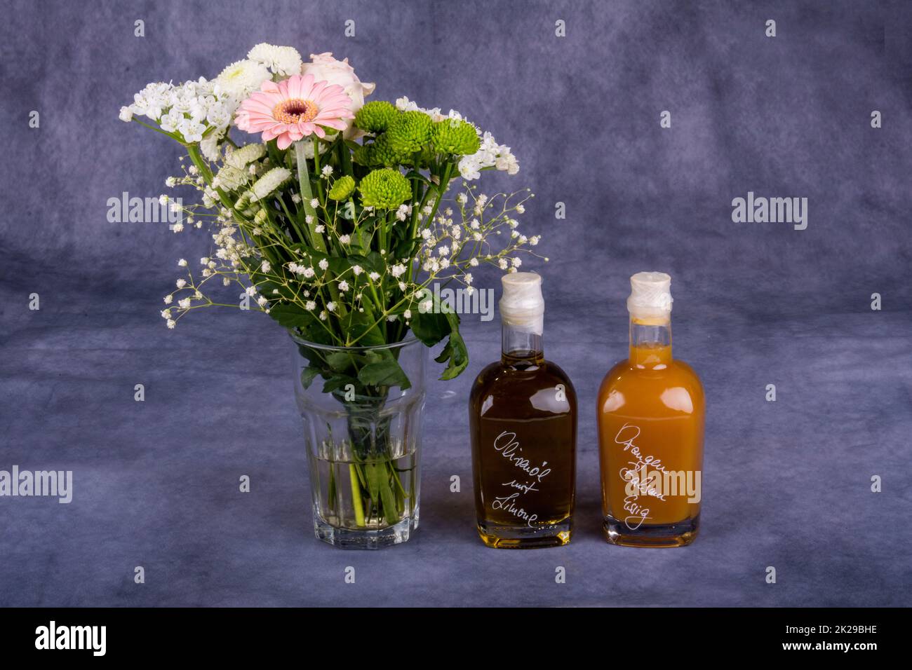 vinegar and oil and flowers - stillife Stock Photo