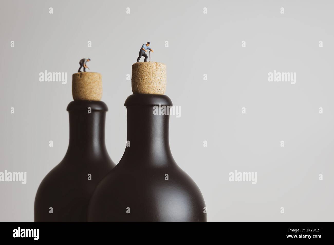 Retro-style people open up a black bottle Stock Photo
