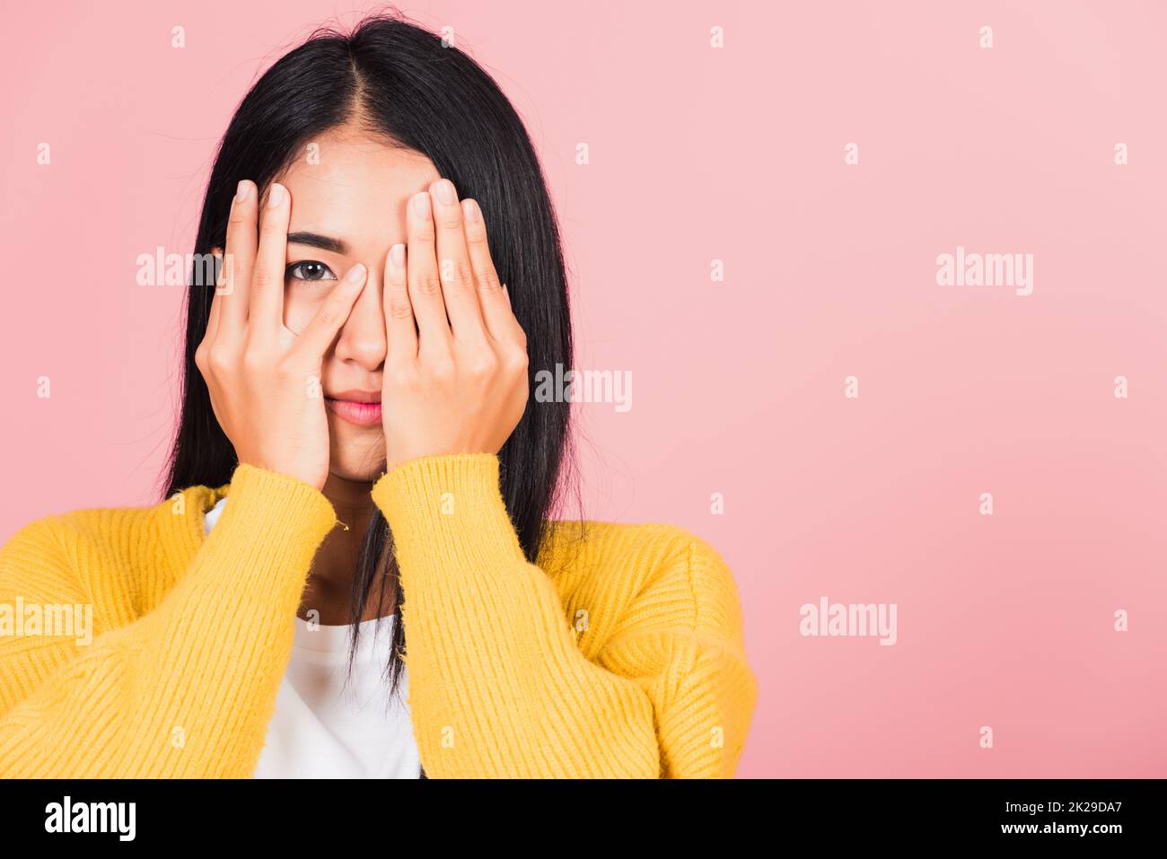 woman in depressed bad mood covering face with hands Stock Photo