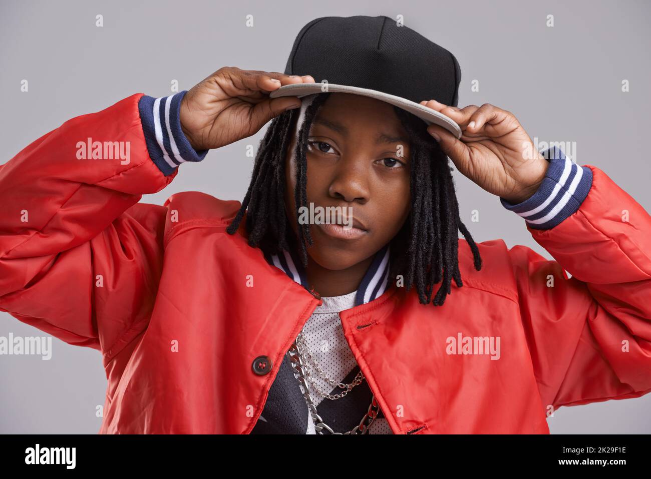 Rocking his swag. Studio shot of a young boy dressed in hip hop attire