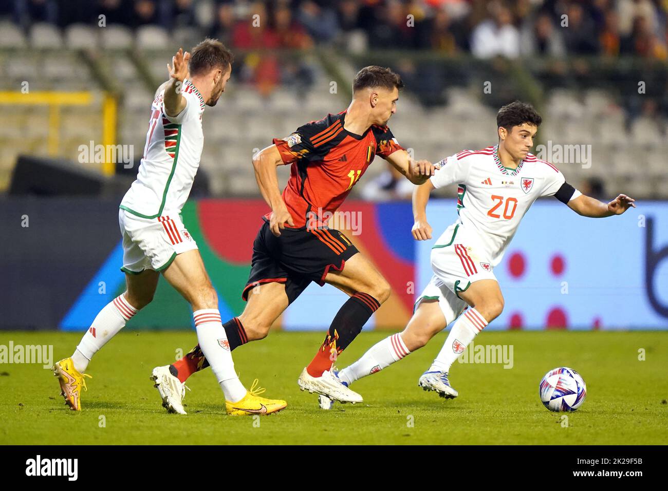 Wales' Daniel James (right) and Belgium's Thomas Meunier battle for the ball during the UEFA Nations League Group D Match at King Baudouin Stadium, Brussels. Picture date: Thursday September 22, 2022. Stock Photo