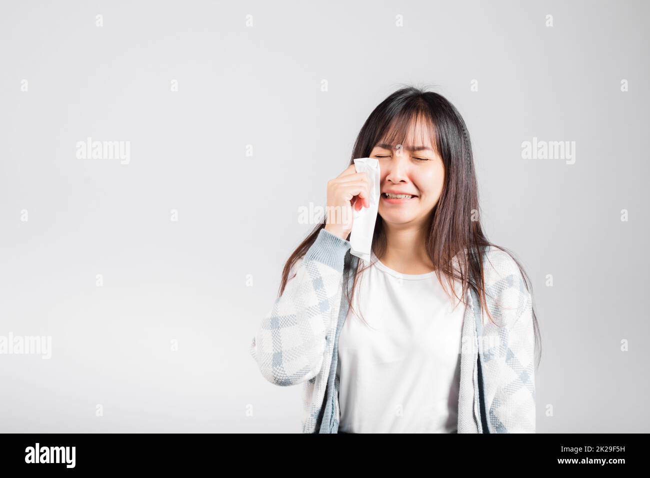 Unhappy woman bad mood her cry wipe mucus with tissue Stock Photo - Alamy