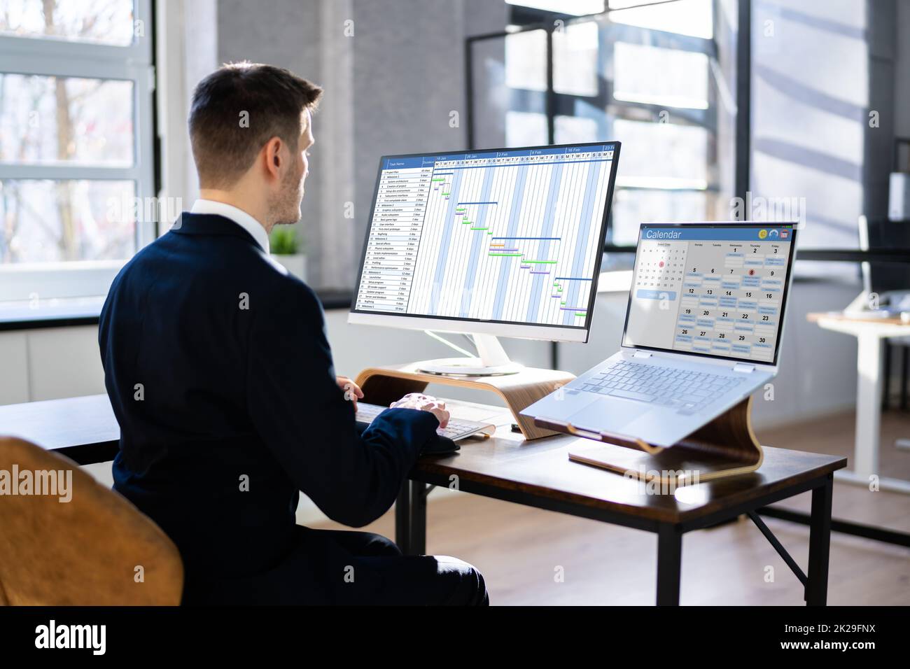 Man Working On Calendar Agenda Schedule Stock Photo