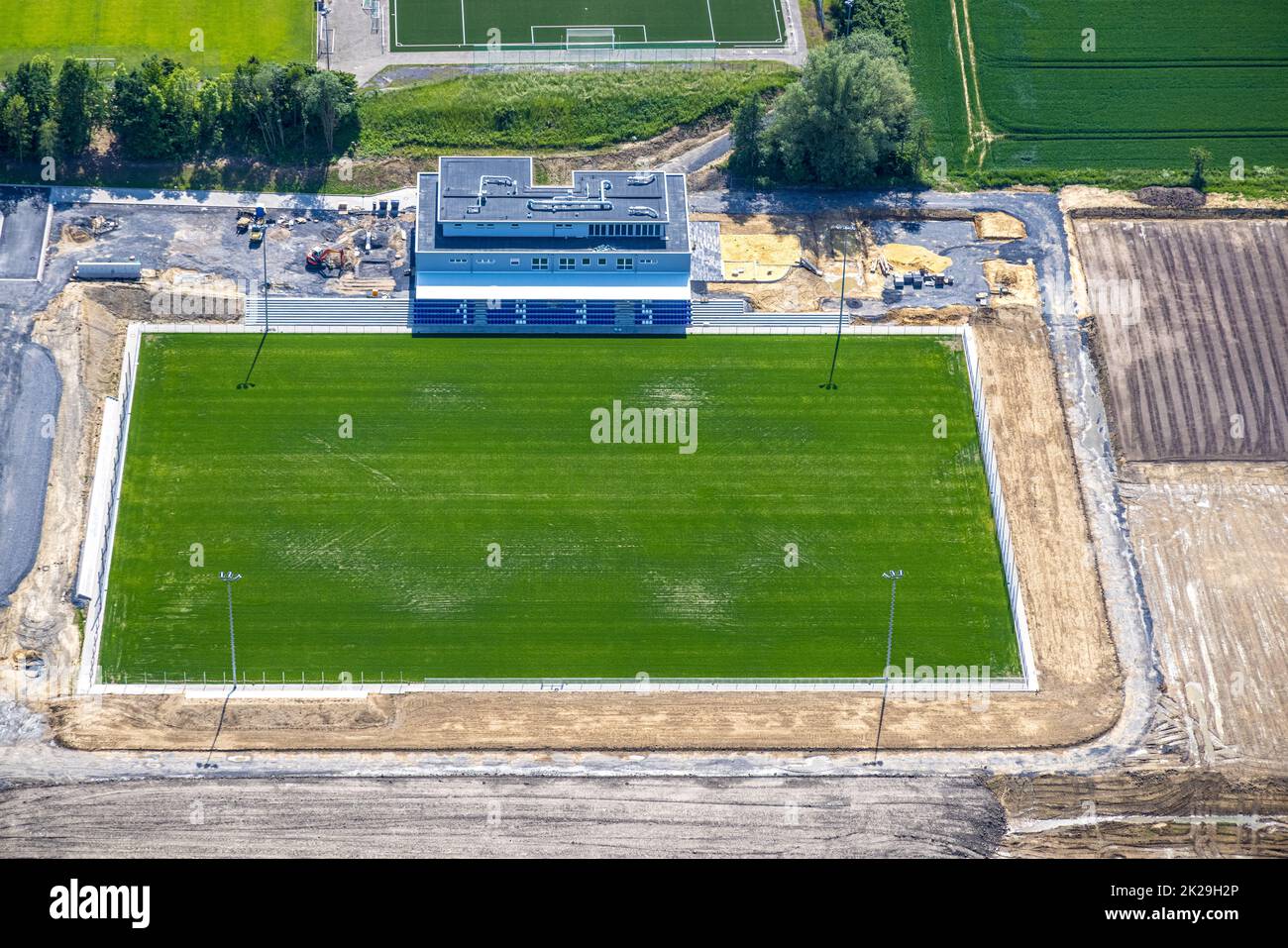 Aerial view, construction site and new building Westfalia Sportpark, sports field and club center Westfalia Rhynern with integrated sports day care ce Stock Photo