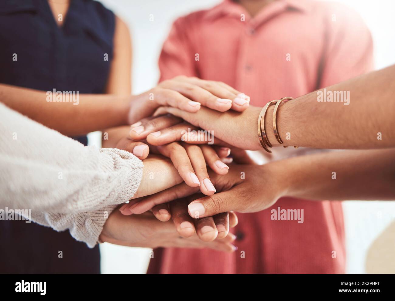 Hands, support and motivation of diversity of friends showing a helping hand and community. People in a group circle with trust, friendship love and Stock Photo