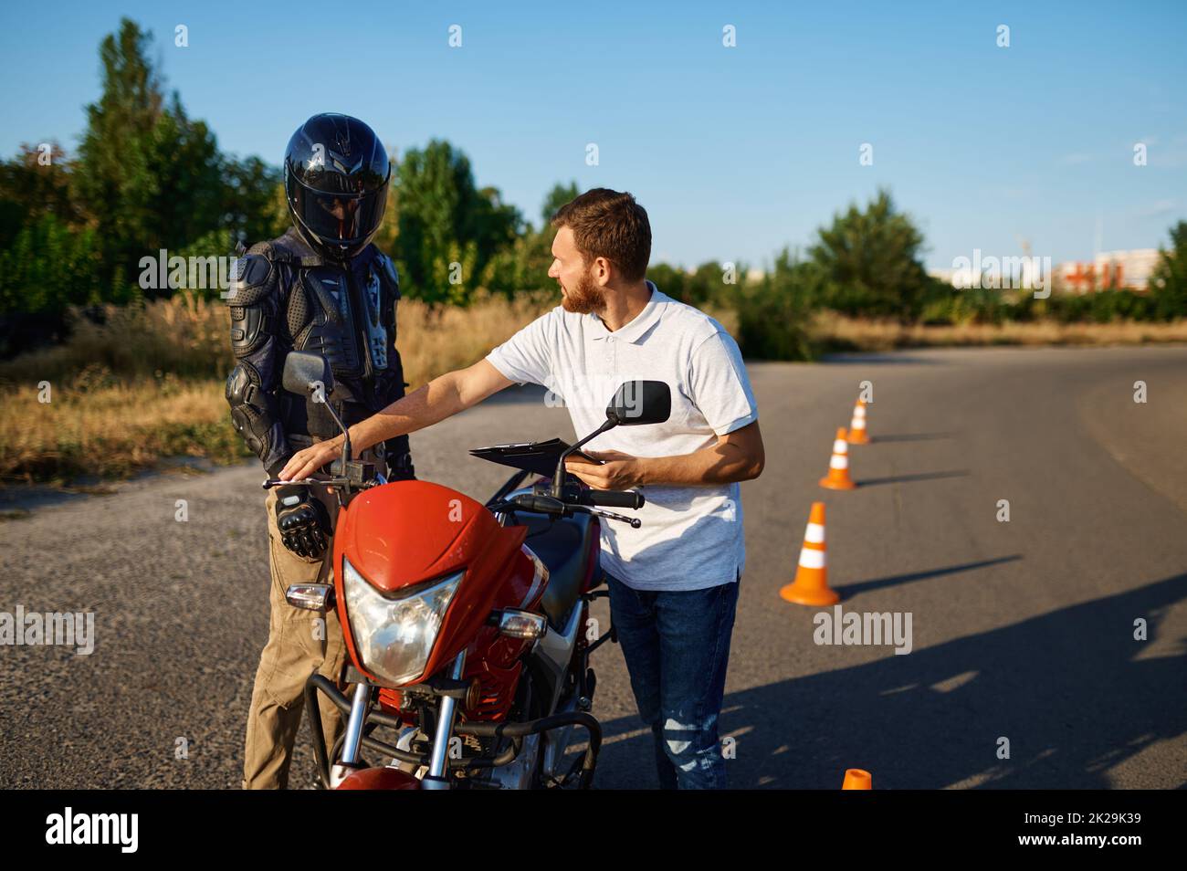 Male student and instructor, lesson in motorschool Stock Photo