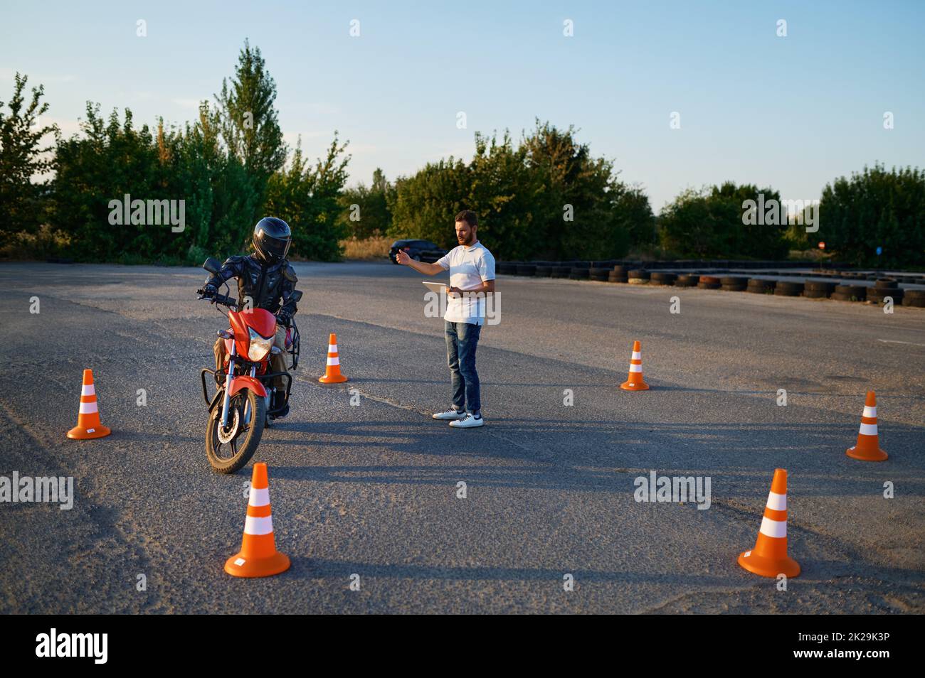 Riding between cones, lesson in motorcycle school Stock Photo