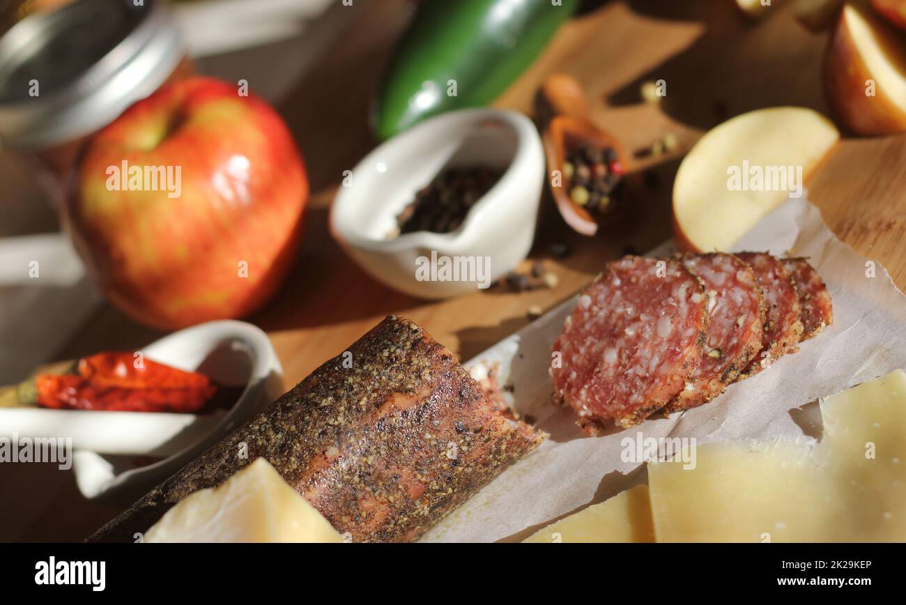 Peppercorn Salami on Tray With English and Irish Cheese, Sliced Apples