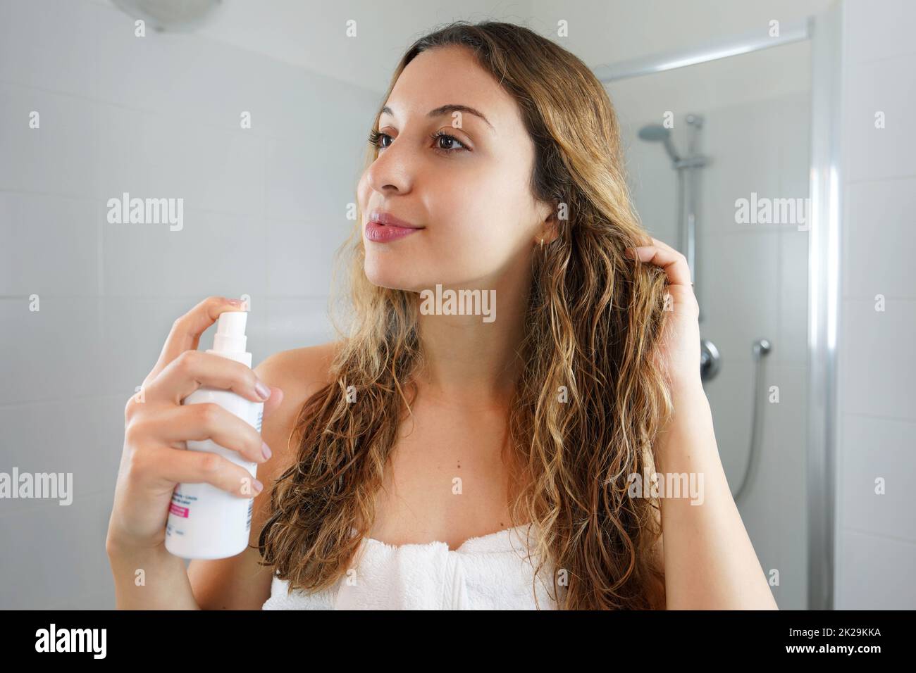 Hair thermal protection. Smiling woman with healthy beautiful long wavy