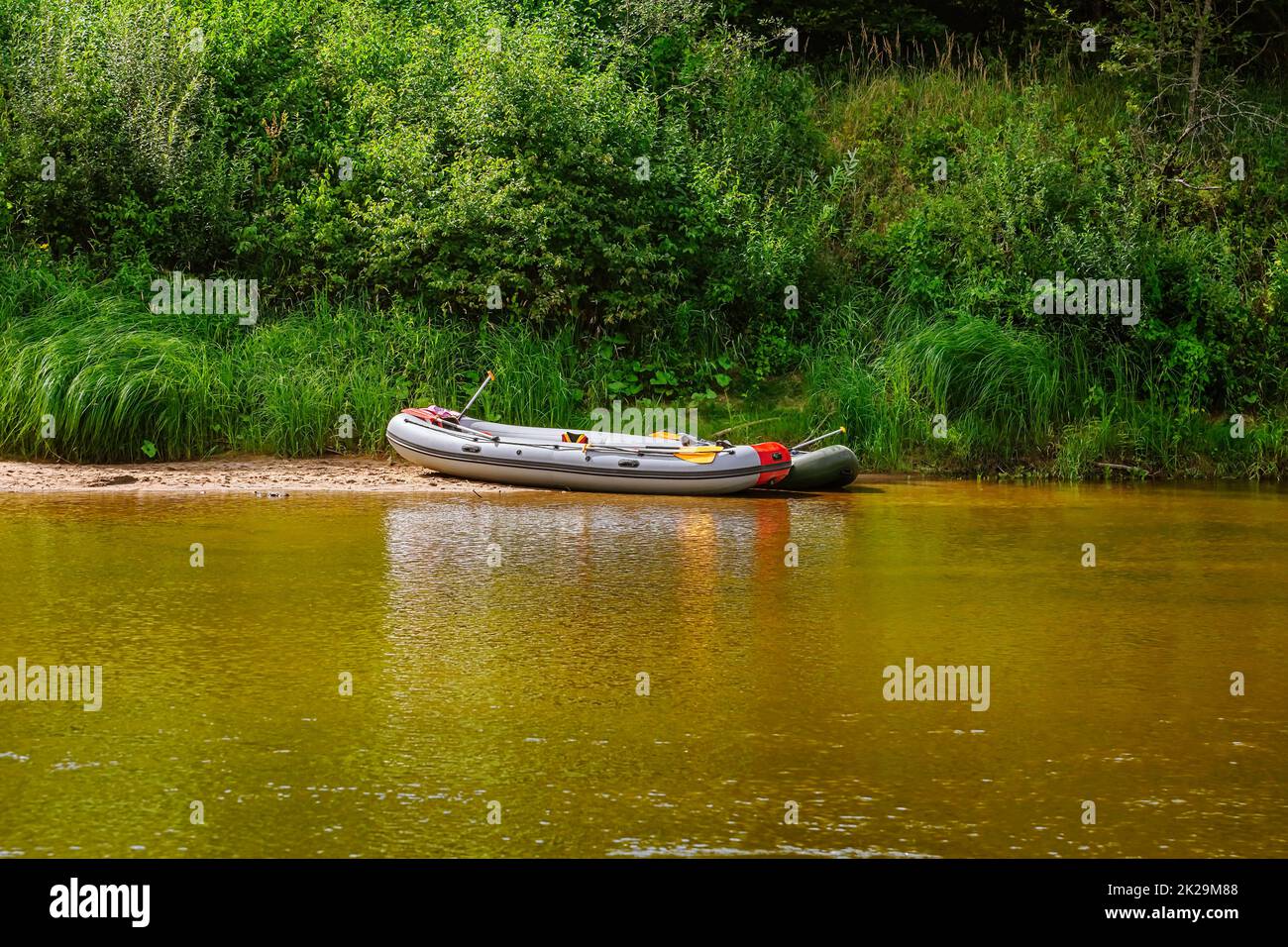 Boat on the river bank Stock Photo - Alamy