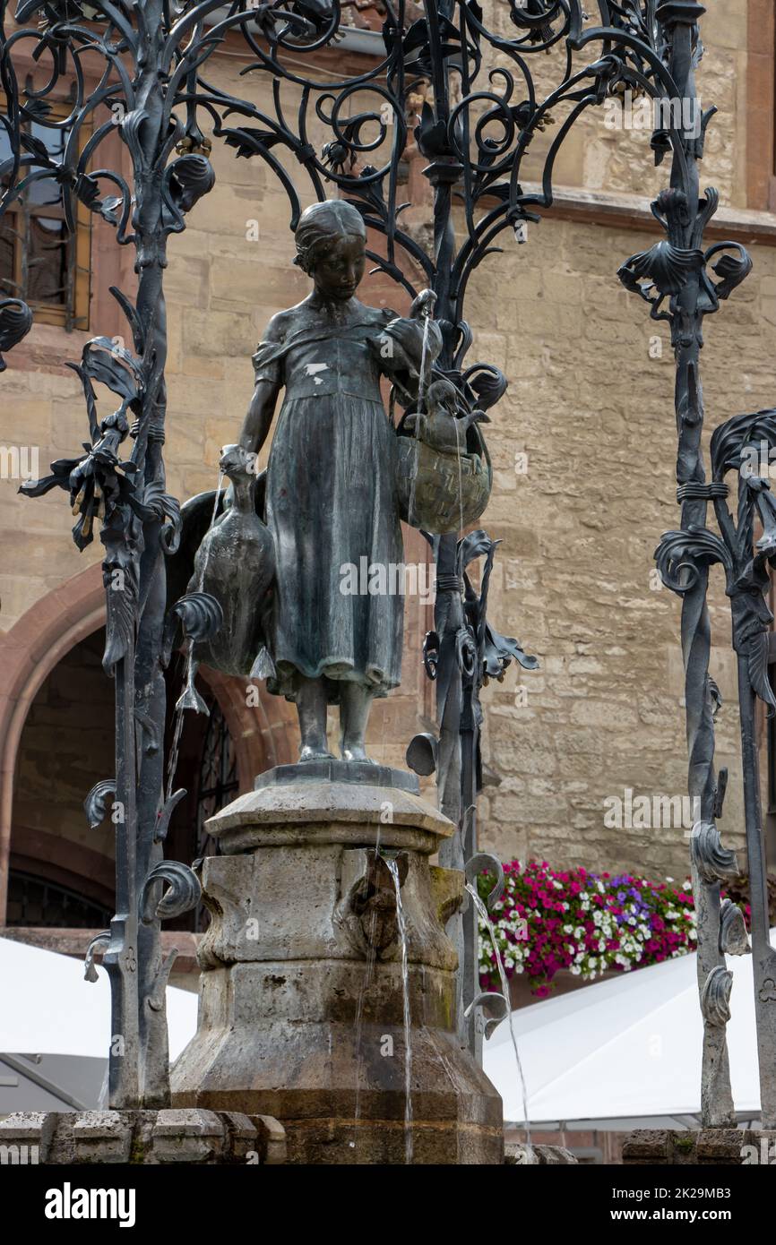 The GÃ¤nseliesel in GÃ¶ttingen is considered the most kissed woman in the world. It has stood on the old market square in front of the historic GÃ¶ttingen town hall since 1901. Stock Photo