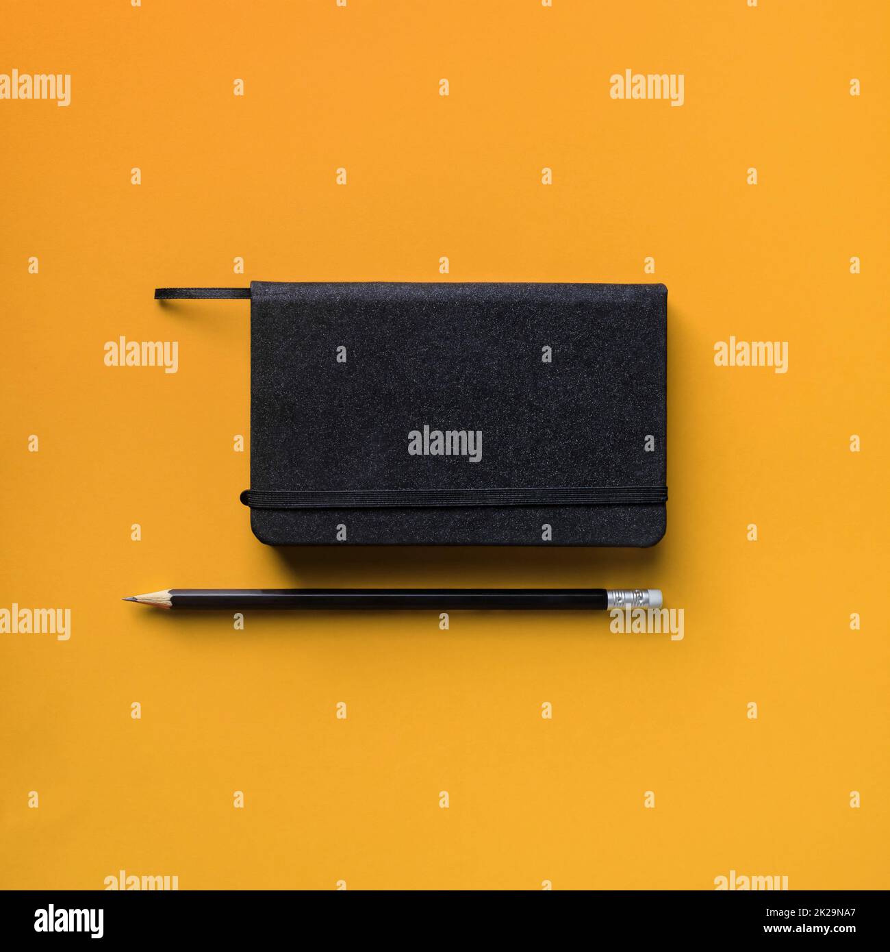 Notepad and pencil Stock Photo - Alamy