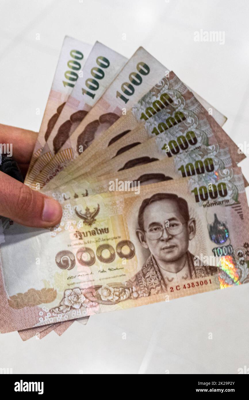 Thai money banknotes 8000 Thai Baht on white background. Stock Photo