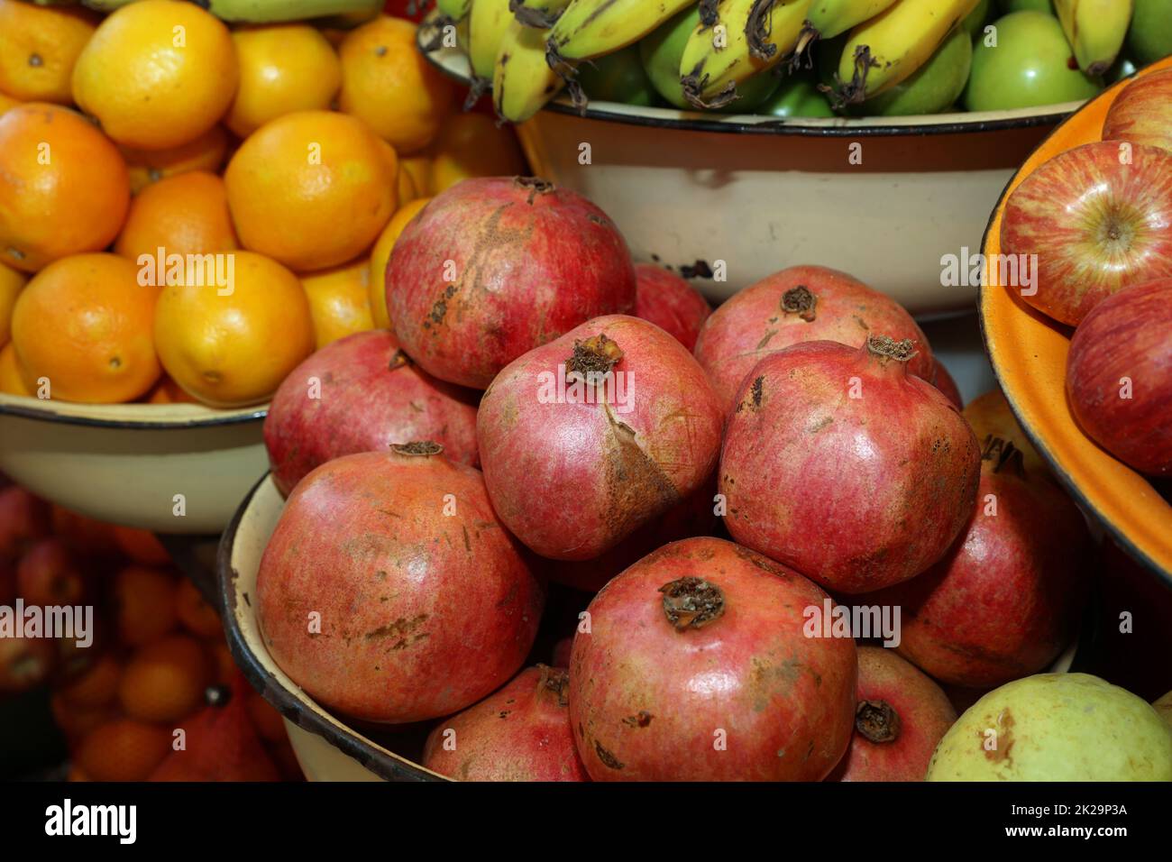 Pomegranate with Orange and Apples on Street Market in Tel Aviv. Israel Stock Photo