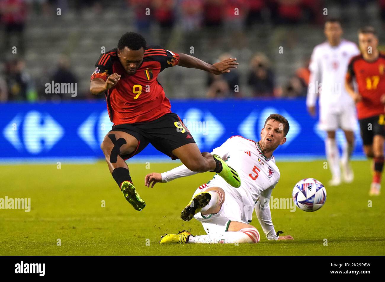 Wales' Chris Mepham tackled Belgium's Lois Openda (left) during the UEFA Nations League Group D Match at King Baudouin Stadium, Brussels. Picture date: Thursday September 22, 2022. Stock Photo