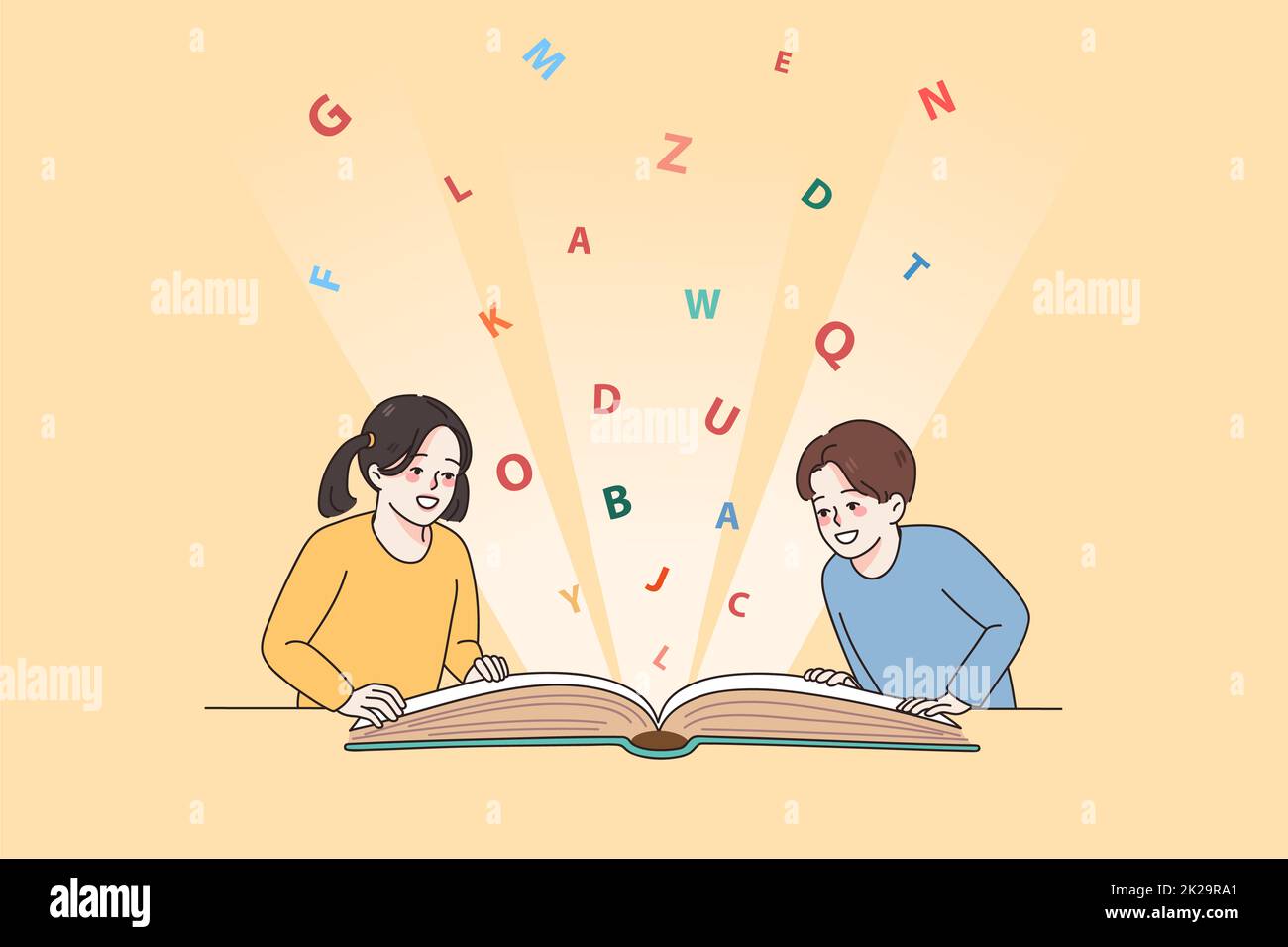Happy small kids reading book together Stock Photo