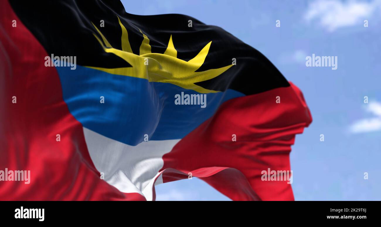Detail of the national flag of Antigua and Barbuda waving in the wind on a clear day Stock Photo
