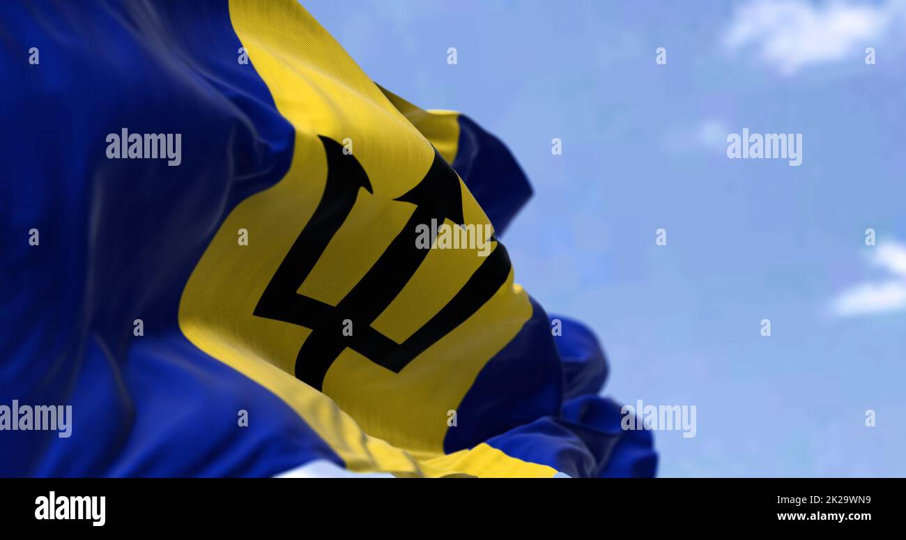 Detail of the national flag of Barbados waving in the wind on a clear day. Stock Photo