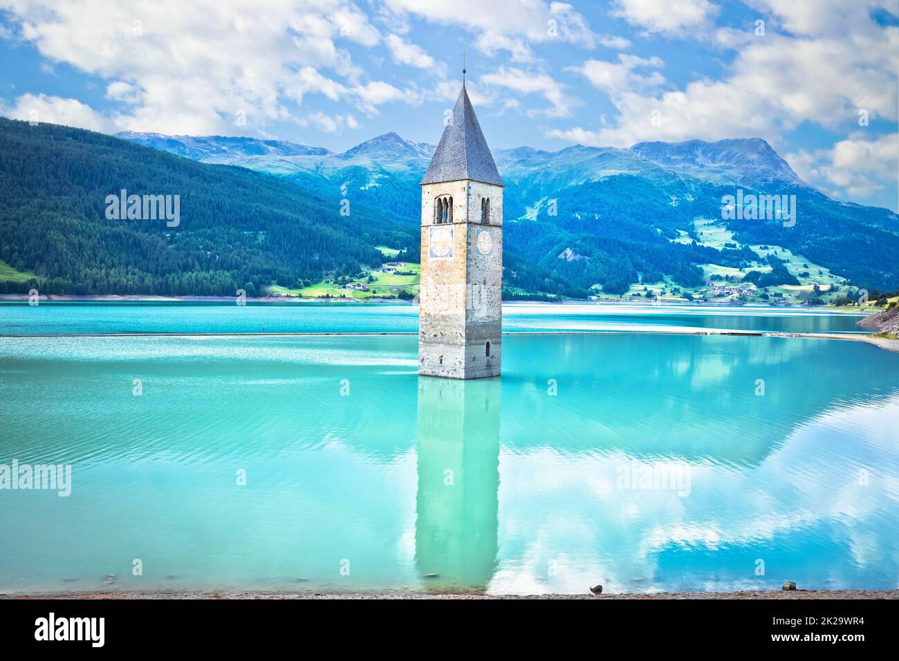 Submerged bell Tower of Curon Venosta or Graun im Vinschgau on Lake Reschen landscape view Stock Photo