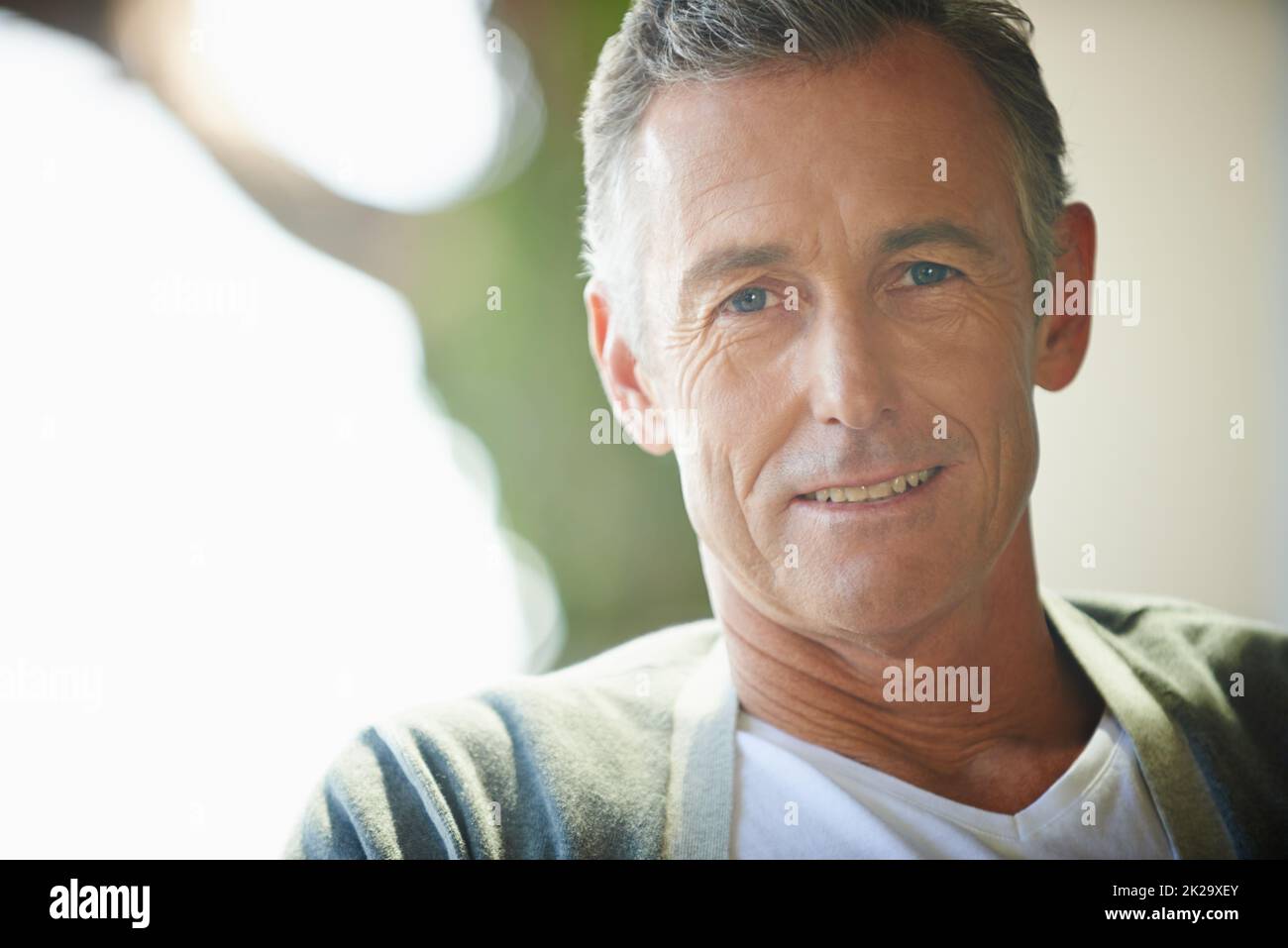 Hes got a lifetime of experience behind him. Cropped view of a handsome mature man looking at the camera. Stock Photo