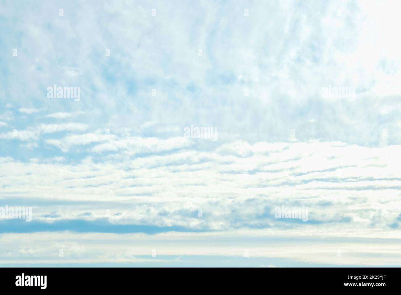 Blue sky with white clouds. Beautiful cloudy sky. Skyward. Endless skyline. The sky at dawn. Stock Photo