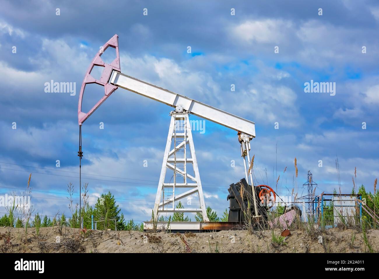 A single-shoulder rocking machine at an oil field. Oil and gas production. Stock Photo