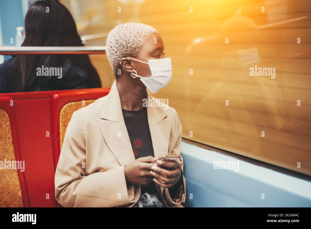 African woman sitting alone side view hi-res stock photography and ...