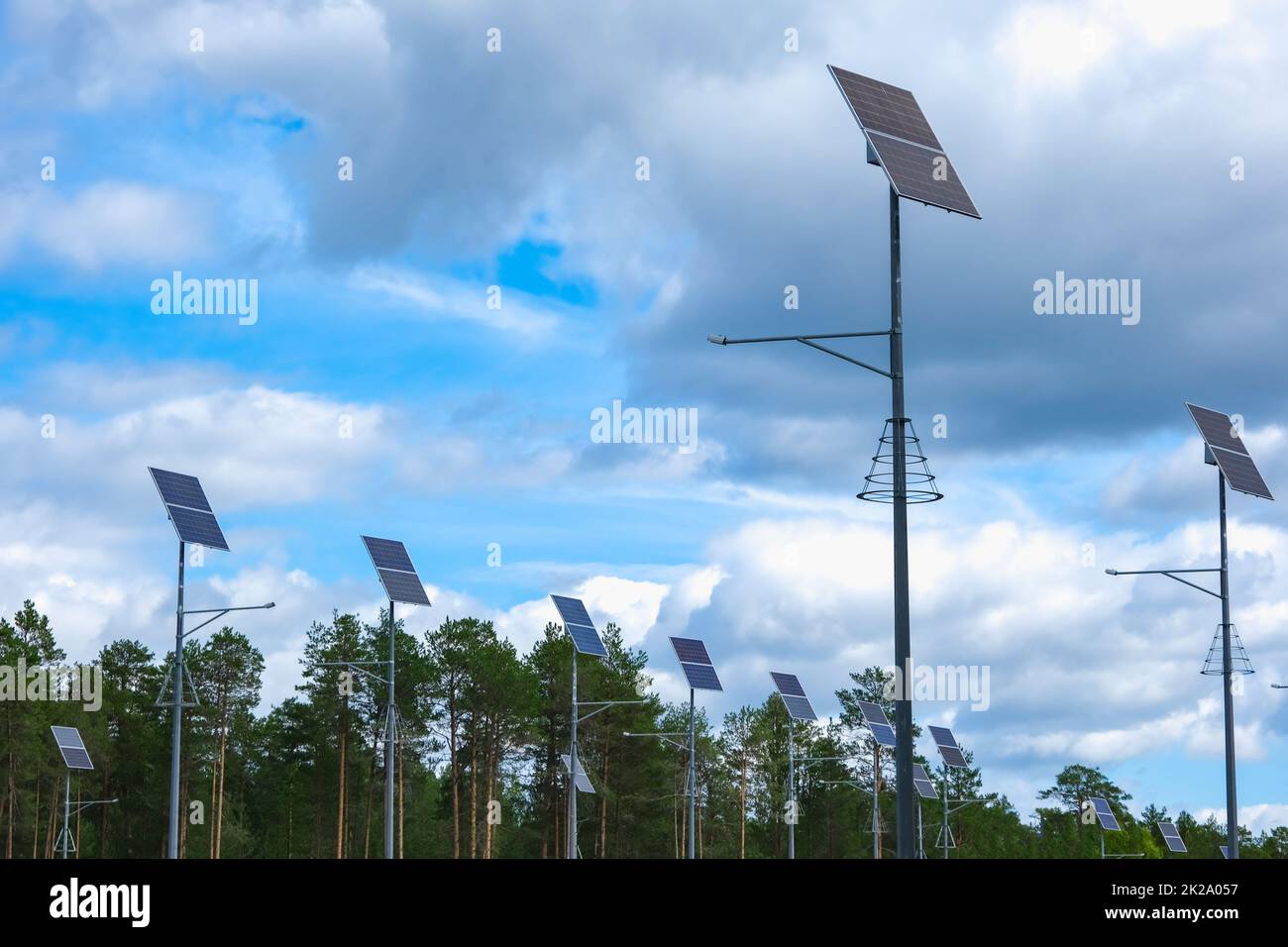 Solar panels on lampposts. Renewable energy sources in the countryside. Stock Photo
