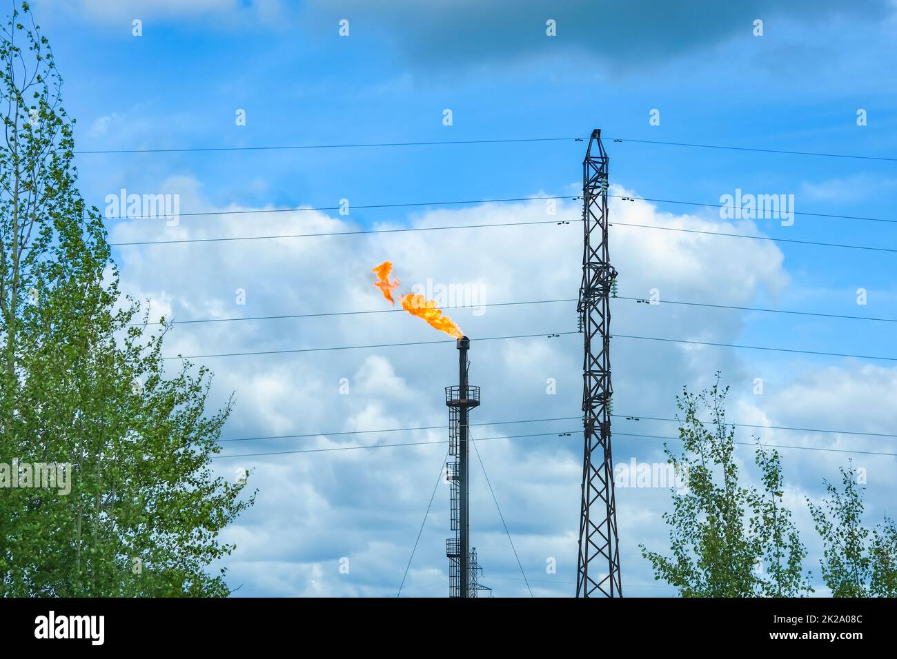 A torch burning associated gas. Gorenje surplus during production in the gas and oil industry. Stock Photo
