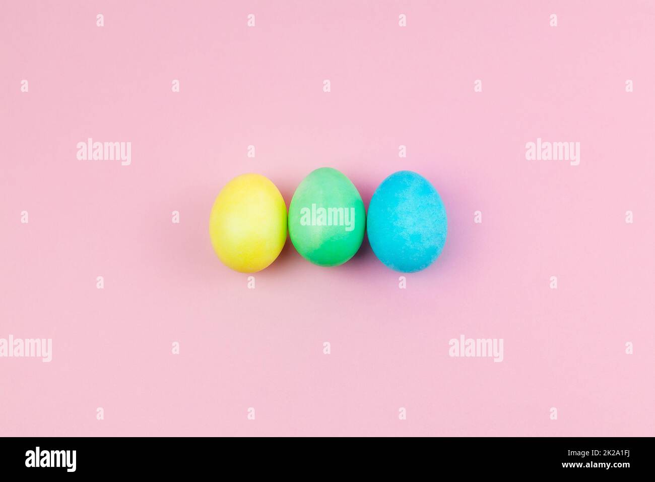 Easter pink composition. Easter eggs on pastel pink background. Minimal concept of Easter. Stock Photo