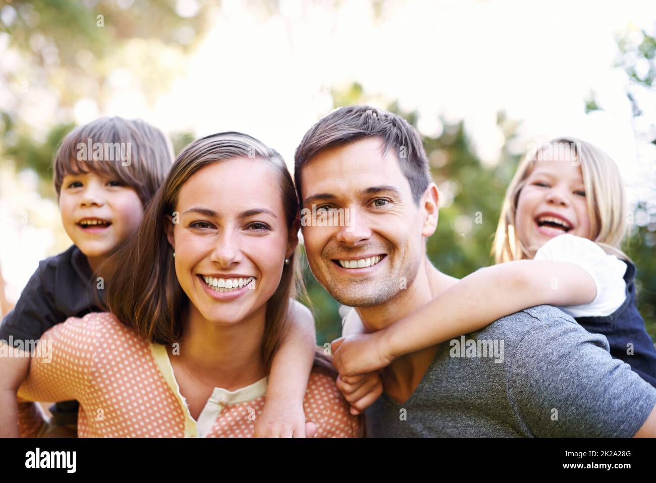 Four is the perfect number. Portrait of a happy young family of four. Stock Photo