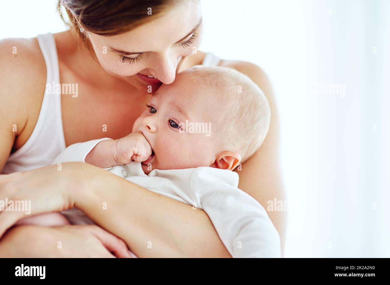 Tender moments with Mom. Shot of an adorable baby boy bonding with his mother at home. Stock Photo